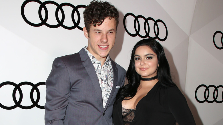 Nolan Gould smiles beside Ariel Winter