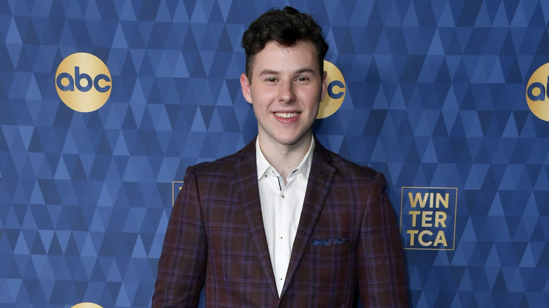 Nolan Gould wearing plaid coat