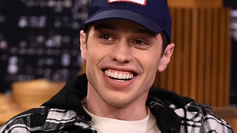 Pete Davidson smirking