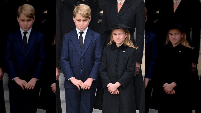 Prince George frowning beside Princess Charlotte