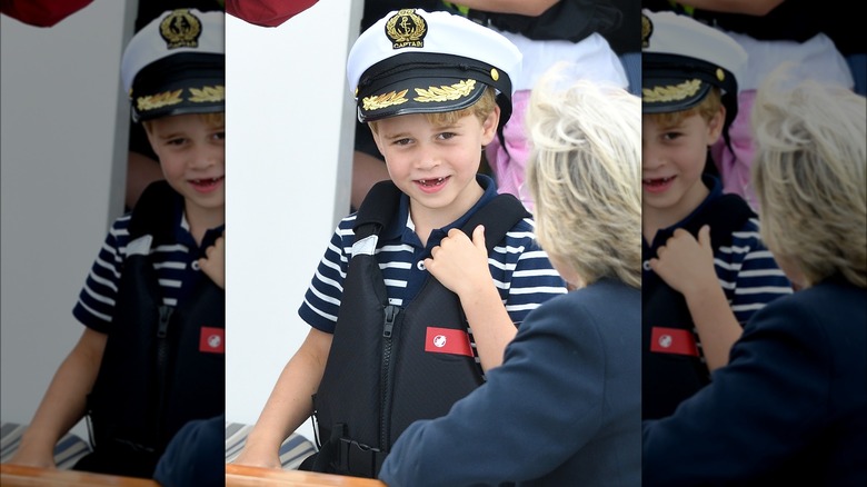 Prince George wearing captain's hat