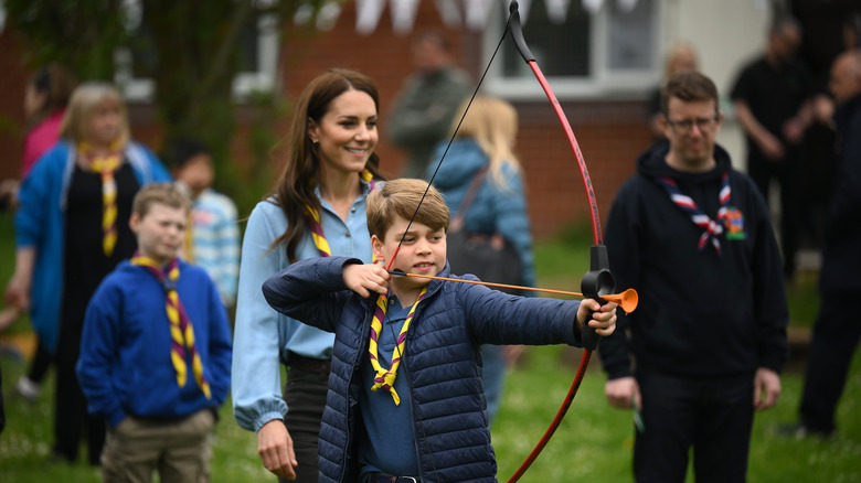 Prince George firing arrow