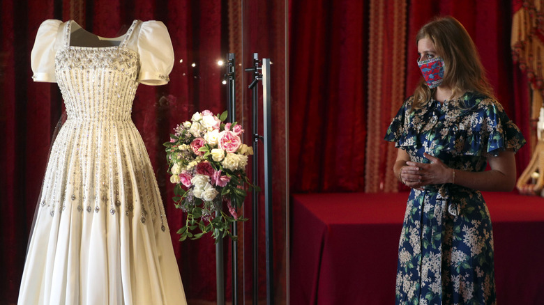 Princess Beatrice poses by wedding dress