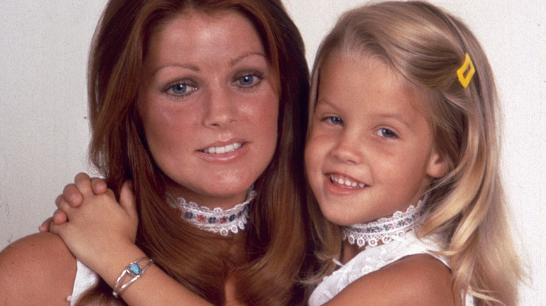 Priscilla Presley and Lisa Marie hugging in 1973