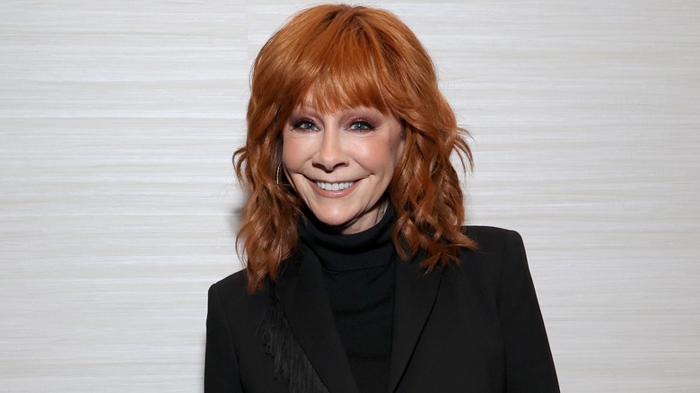 Reba McEntire wearing a black turtleneck