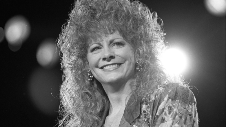 Reba McEntire smiling on stage