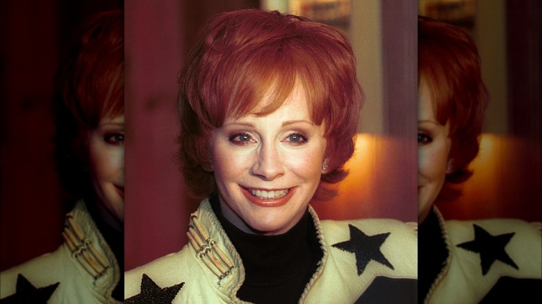 Reba McEntire wearing a jacket with stars