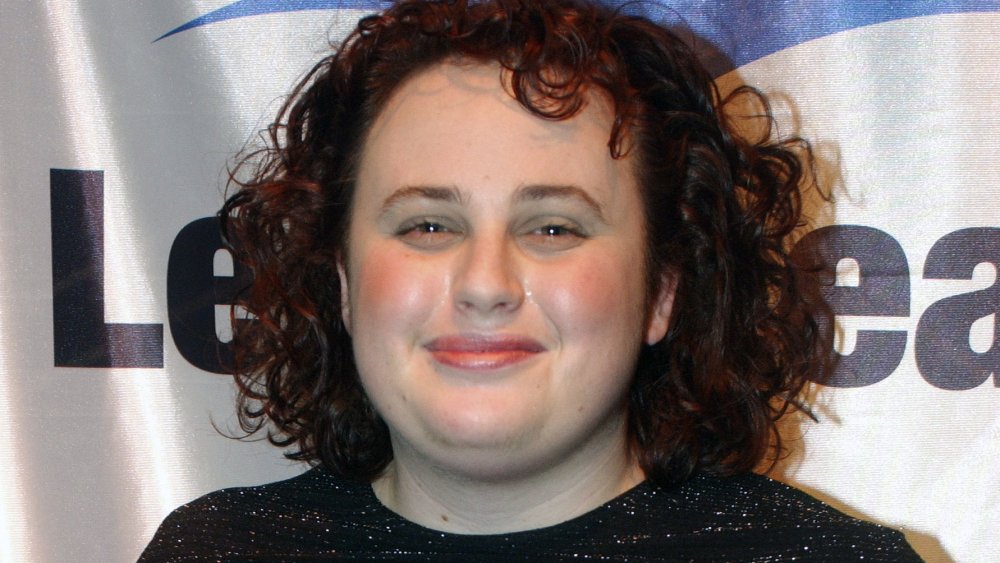 A young Rebel Wilson with curly dark hair