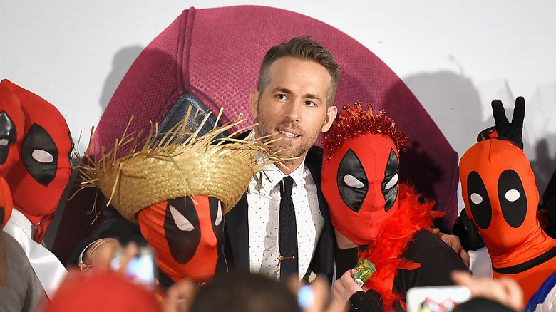 Ryan Reynolds with Deadpool cosplayers