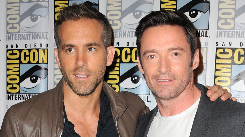 Ryan Reynolds posing with Hugh Jackman