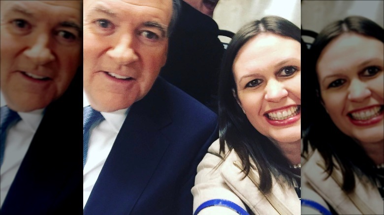 Mike Huckabee and Sarah Huckabee Sanders posing for selfie after debate in 2015