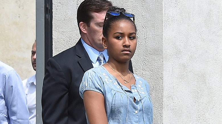 Sasha Obama walking outside Fondazione Prada