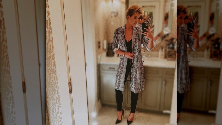 Savannah Chrisley wearing snakeskin print coat