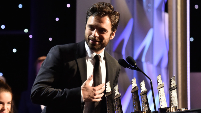 Sebastian Stan onstage accepting award