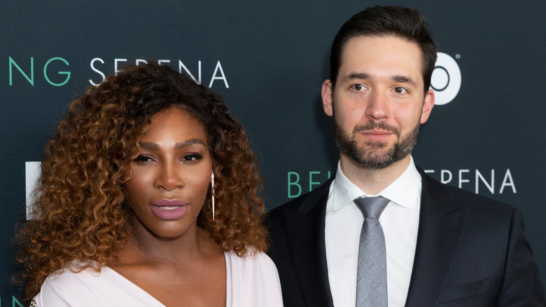 Serena Williams, speaking, next to husband Alexis Ohanian, 2018 event photo