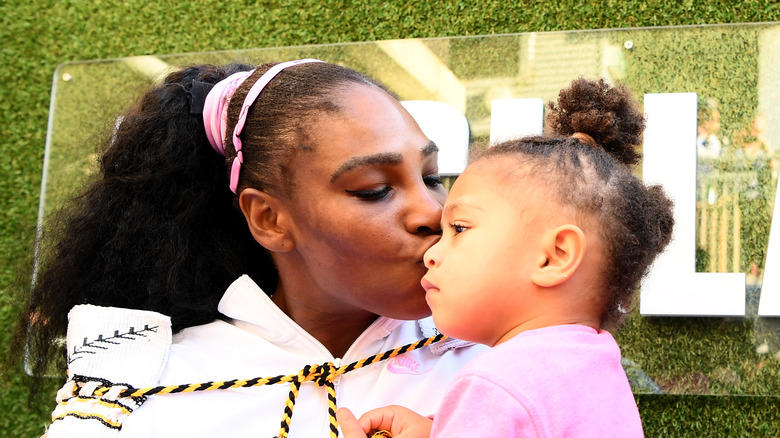 Serena Williams, kissing her toddler daughter Olympia, 2020 event photo