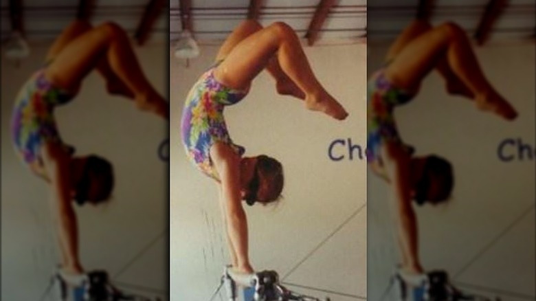 Young Shawn Johnson doing handstand