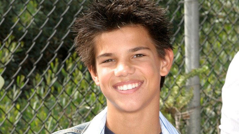 Taylor Lautner as a child grinning