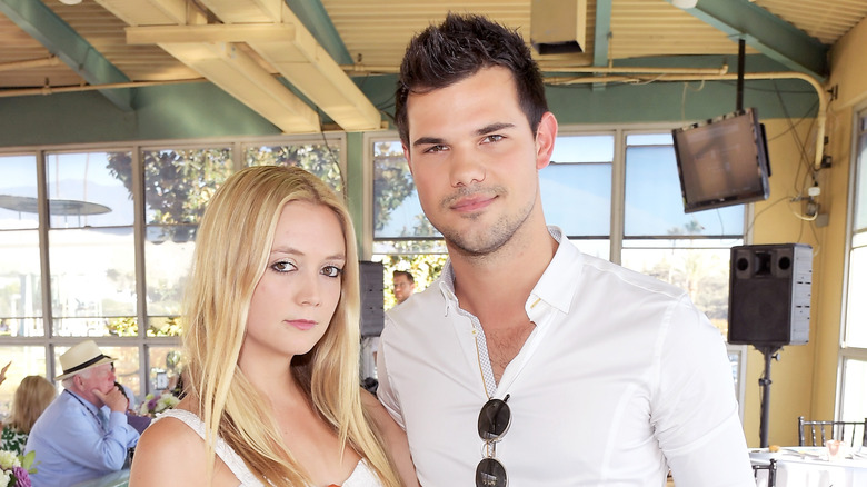 Billie Lourd and Taylor Lautner posing together