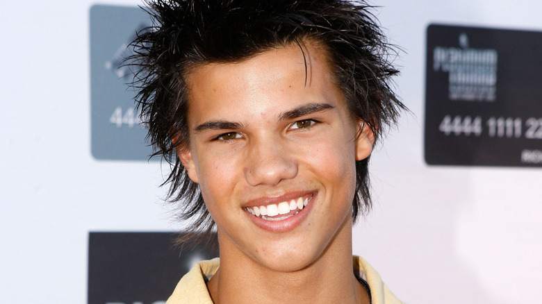 Young Taylor Lautner grinning