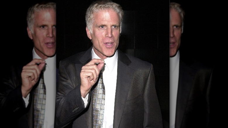 Ted Danson gesturing in suit