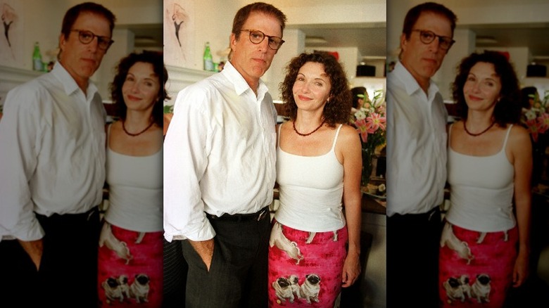 Ted Danson looking serious with smiling Mary Steenburgen