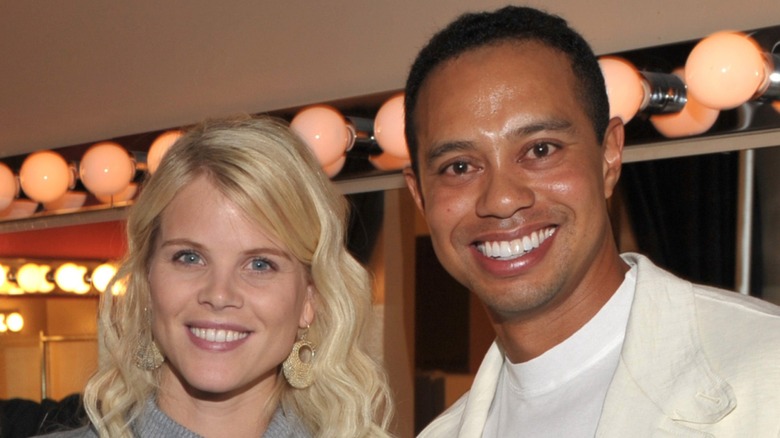 Elin Nordegren and Tiger Woods smiling