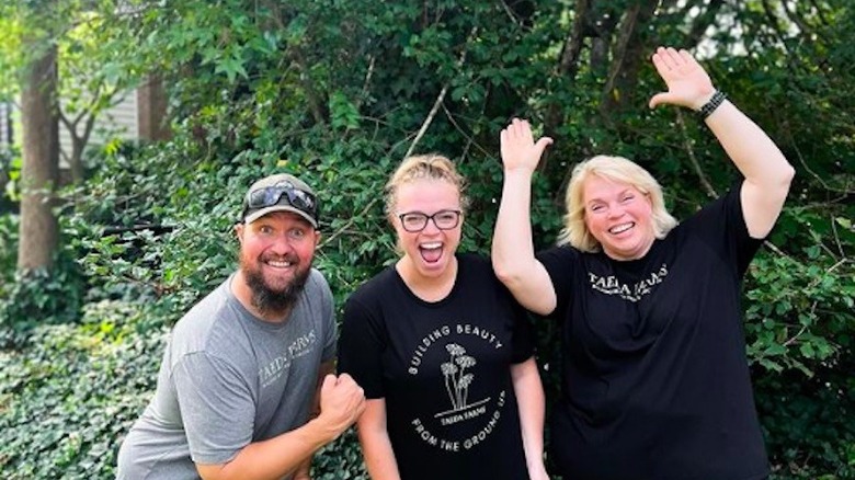 Janelle Brown posing with her daughter and son-in-law