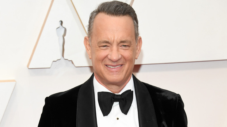 Tom Hanks smiling on the red carpet