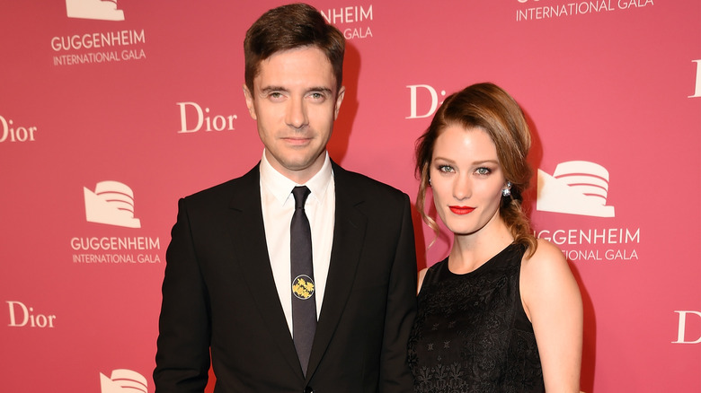 Topher Grace, Ashley Hinshaw wearing black