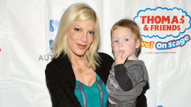 Tori Spelling holding baby Liam