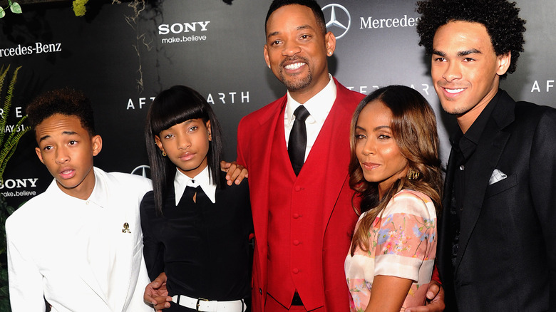 Will Smith smiling with his family 