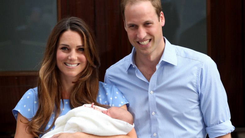 Kate Middleton and Prince William pose with an infant Prince George