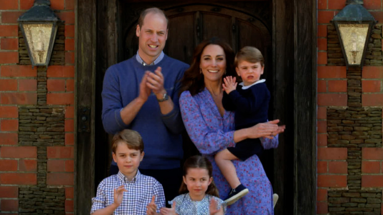 Prince William, Kate Middleton, and their kids clapping