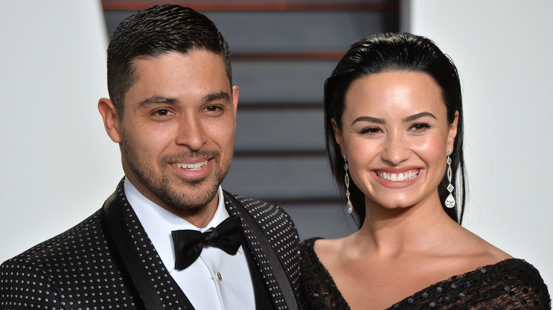 Wilmer Valderrama, Demi Lovato, smiling in 2016