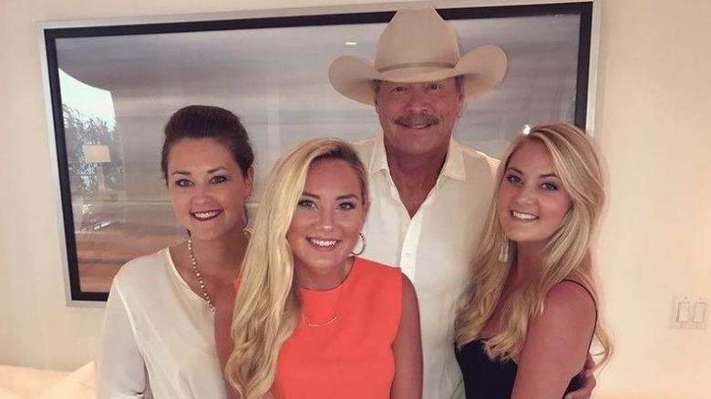 Alan Jackson and family, posing and smiling together