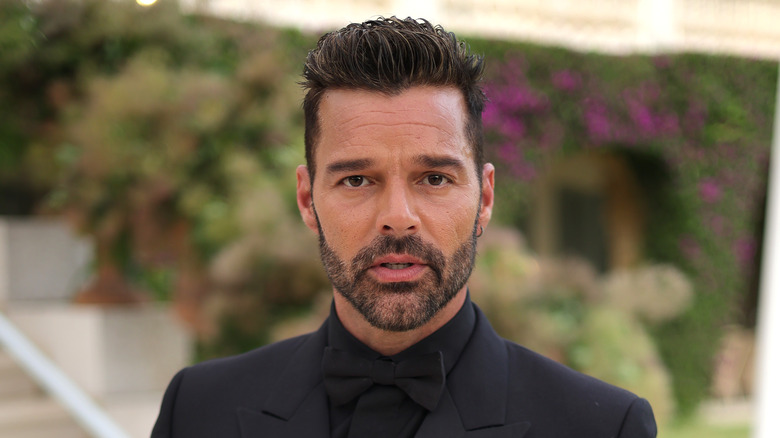 Ricky Martin posing in suit