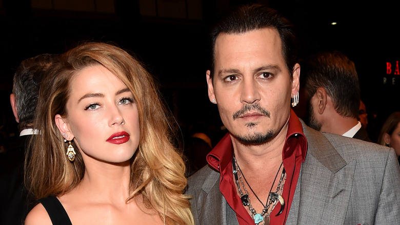 Johnny Depp and Amber Heard posing