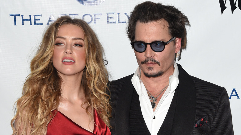 Johnny Depp and Amber Heard posing