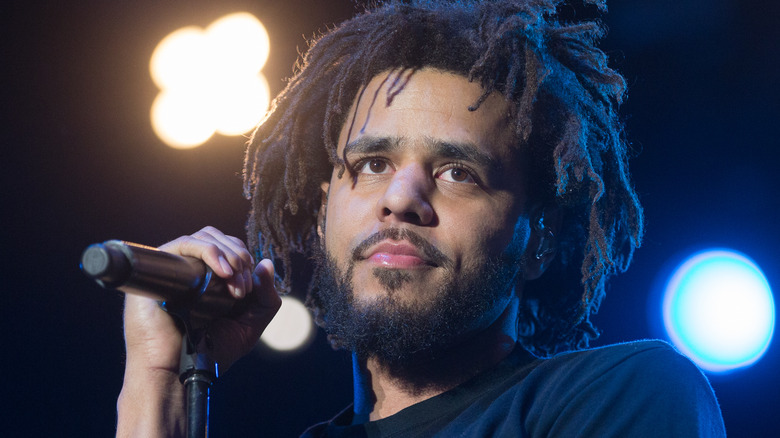 J. Cole looks out from the stage