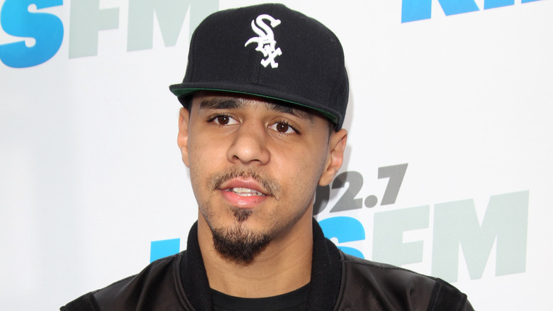 J.Cole wearing baseball cap