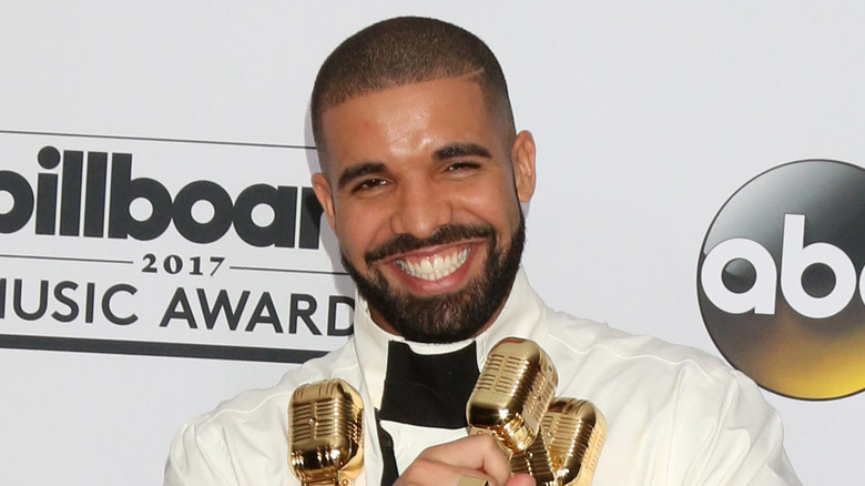 Drake holding Billboard Awards