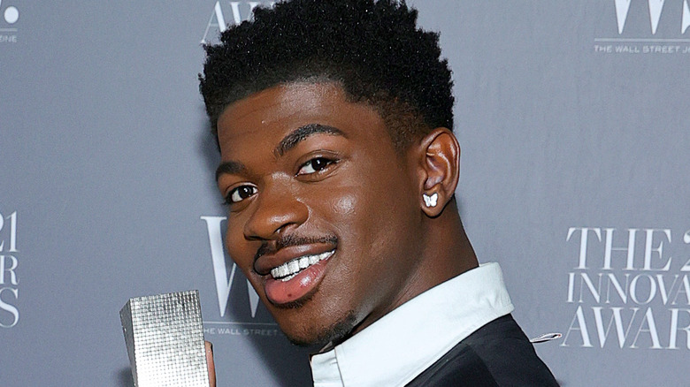 Lil Nas X wearing earrings