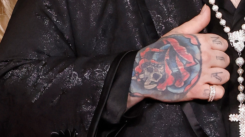Jelly Roll's hand rose tattoo
