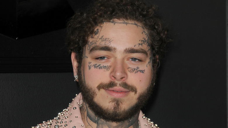 Post Malone slightly smiling