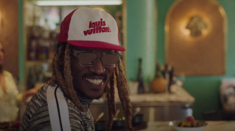 Future smiling in a Louis Vuitton hat