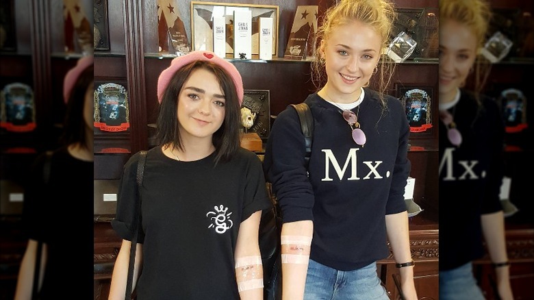 Maisie Williams, Sophie Turner with fresh tattoos