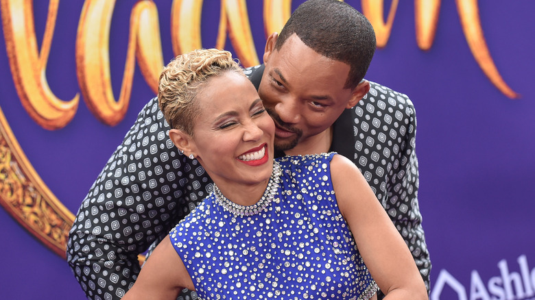 Will Smith and Jada Pinkett Smith hug