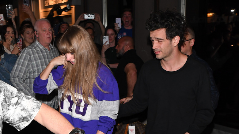 Taylor Swift and Matty Healy walking