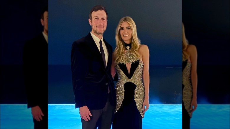 Ivanka Trump wearing a black and silver dress beside Jared Kushner in a suit